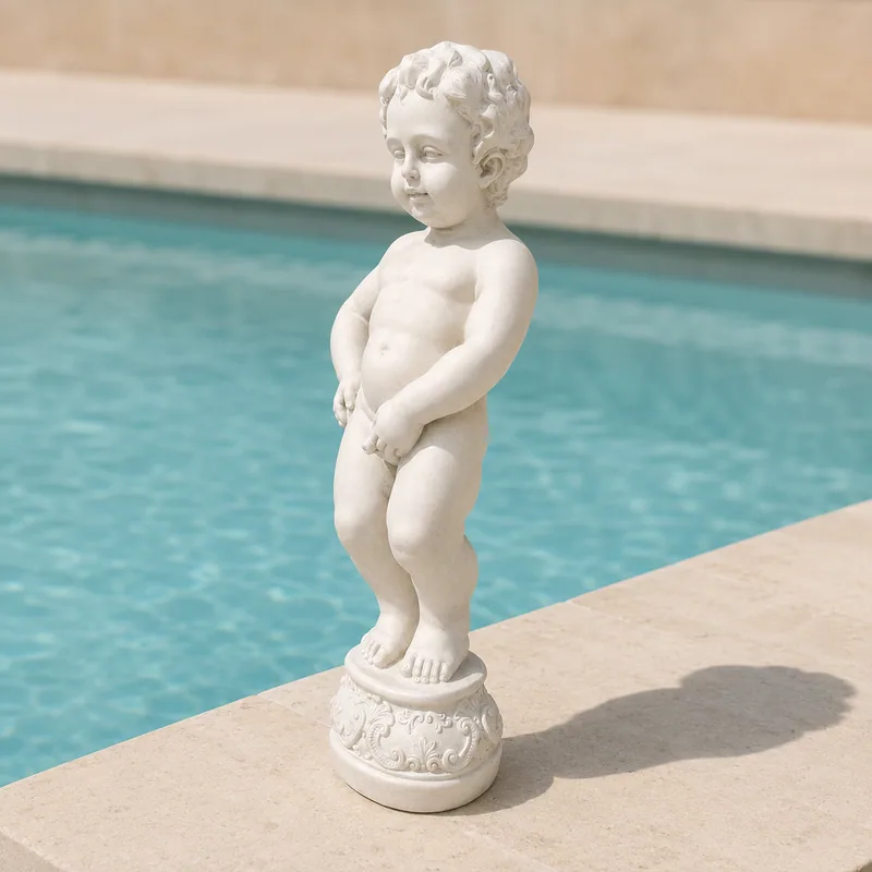 White concrete cherub statue on a decorative pedestal beside a swimming pool