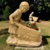 Girl Pushing a Wheelbarrow Concrete Statue